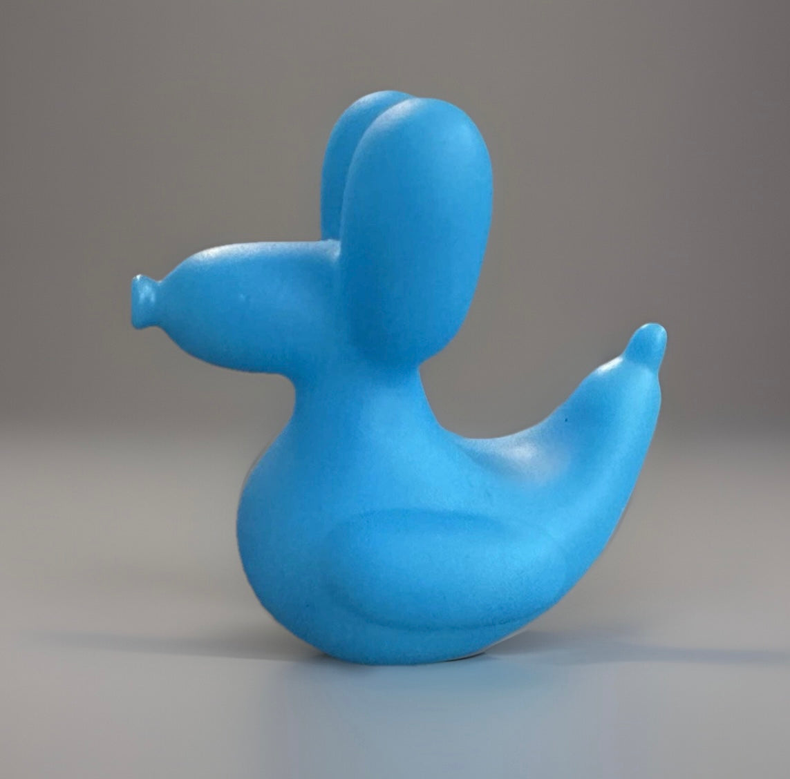 Blue balloon animal rubber duck shaped toy from Reed’s Rubber Ducks and Sensory Shop