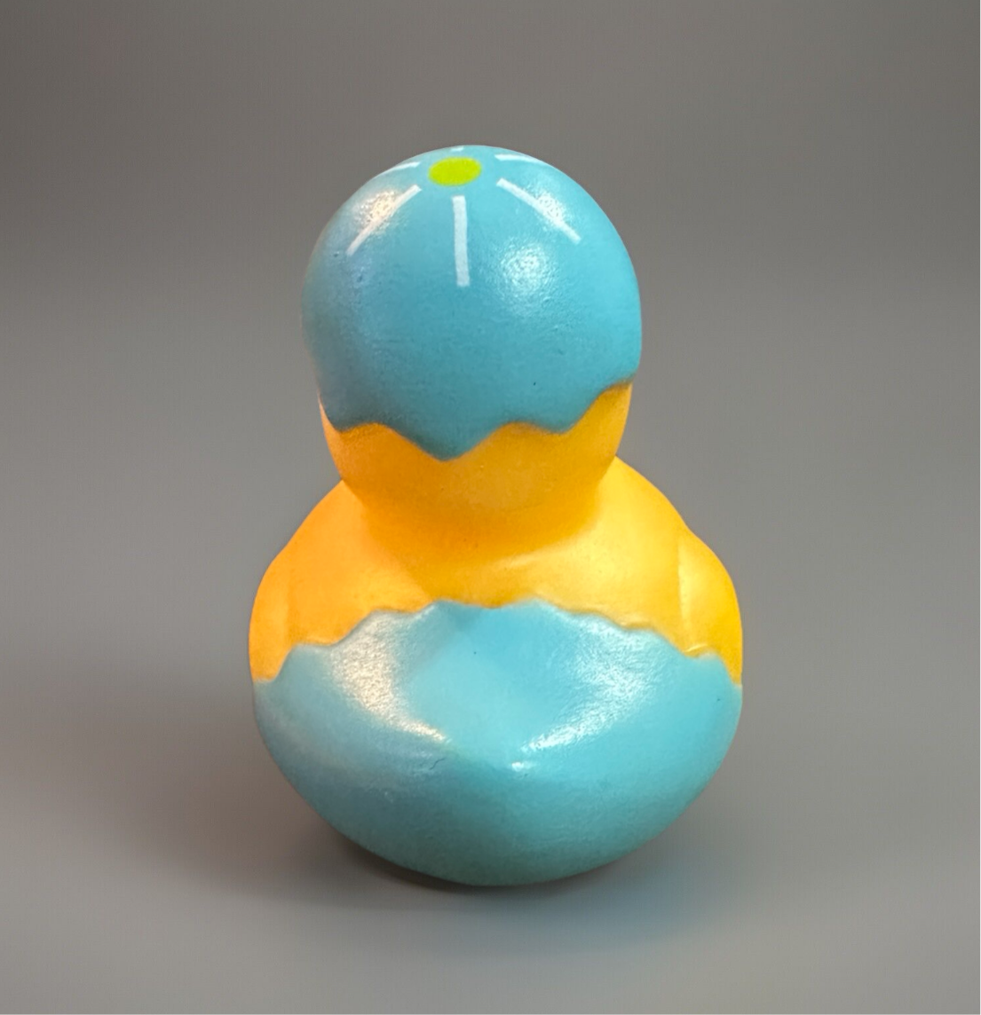 Blue Easter egg rubber duck with a bright yellow accent, perfect for Easter celebrations