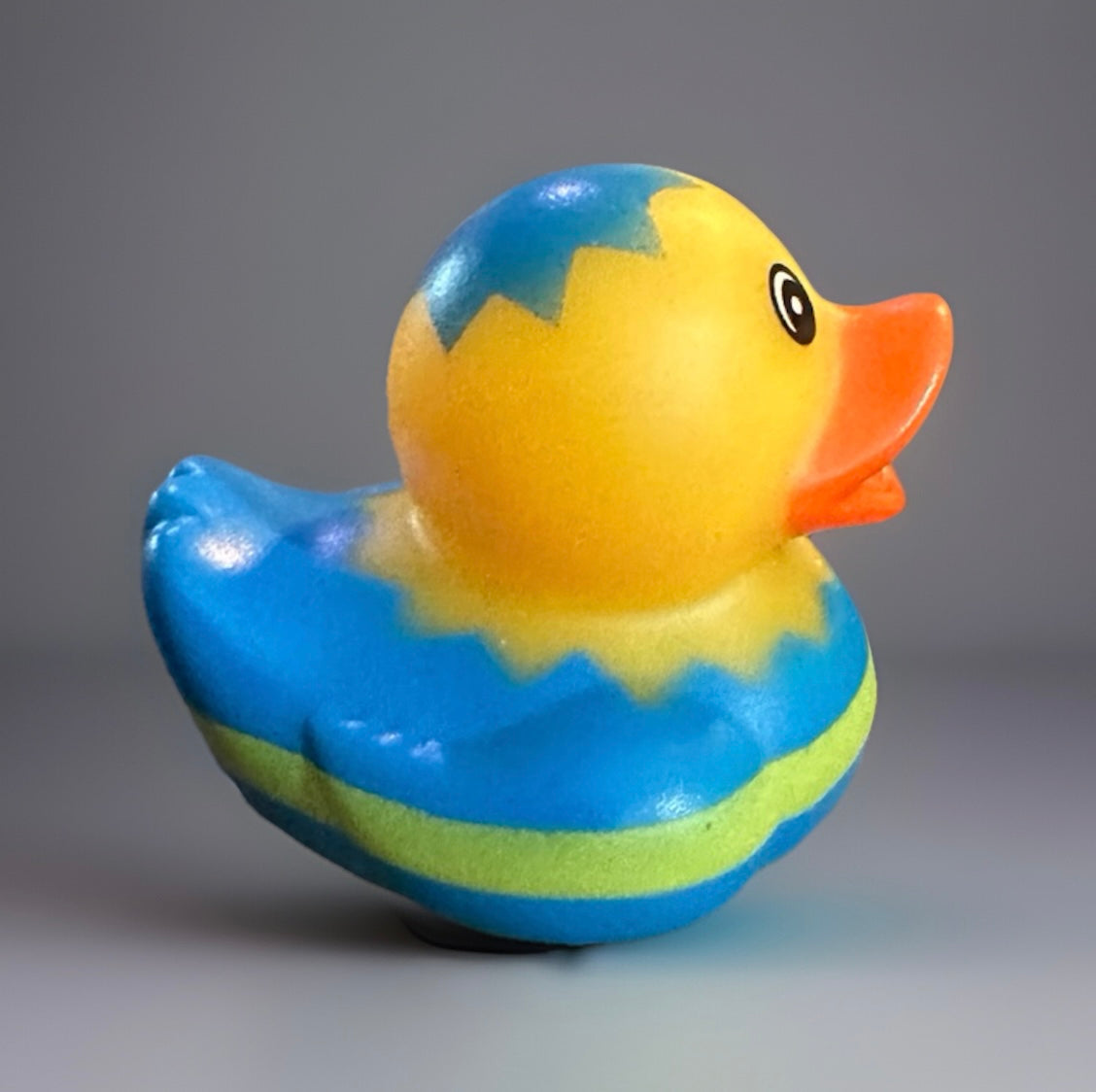 Blue Yellow Easter Rubber Duck with bright orange beak and zigzag pattern on body
