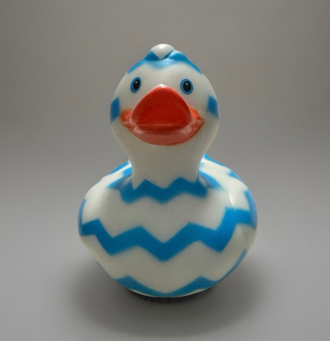 Blue Zig Zag Rubber Duck with bright orange beak and blue zigzag patterns on white body