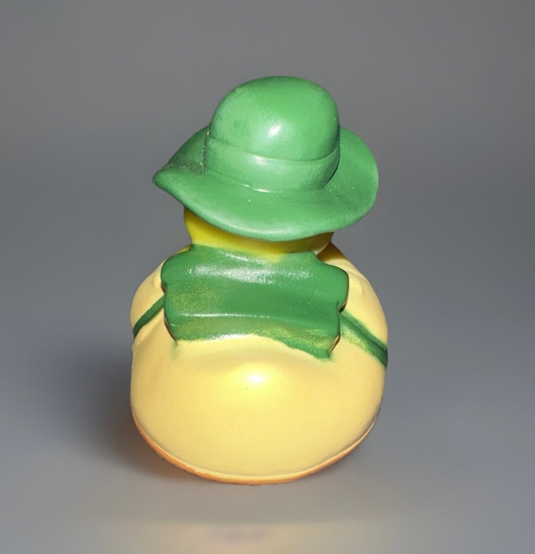 Back view of camper rubber duck collectible wearing green hat and vest from Reed’s Rubber Ducks