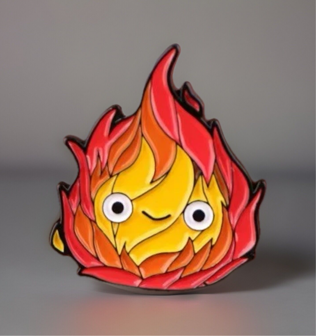 Cute fire anime pins featuring a smiling flame character with vibrant red and yellow colors