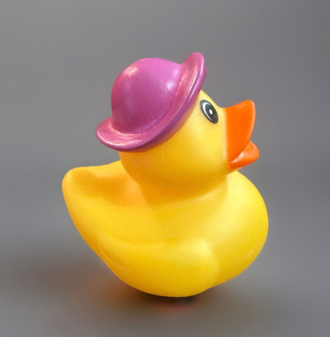 Yellow Easter basket rubber duck wearing a purple hat from Reed’s Rubber Ducks and Sensory Shop