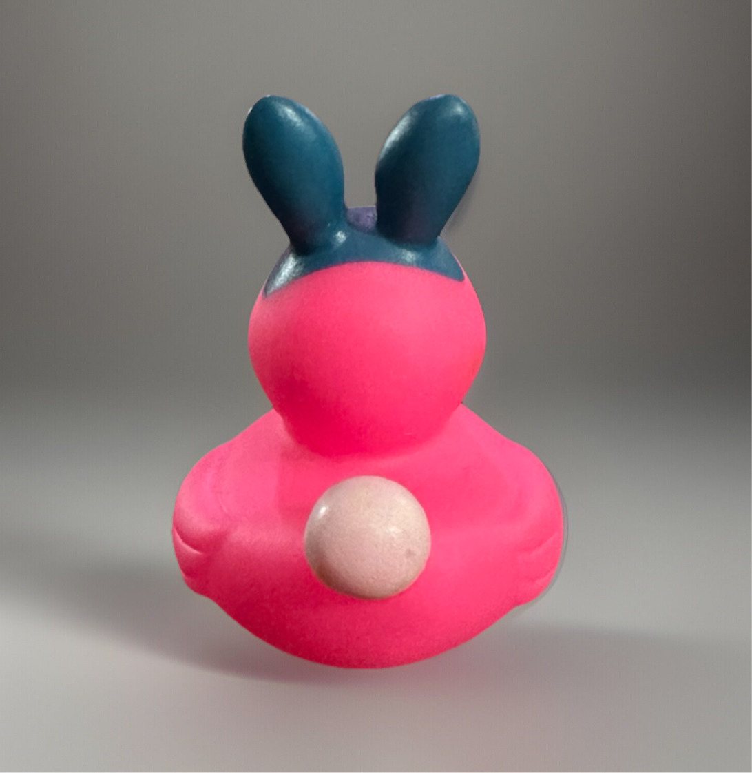Cute pink Easter bunny rubber duck with blue ears, perfect for Easter celebrations and sensory play