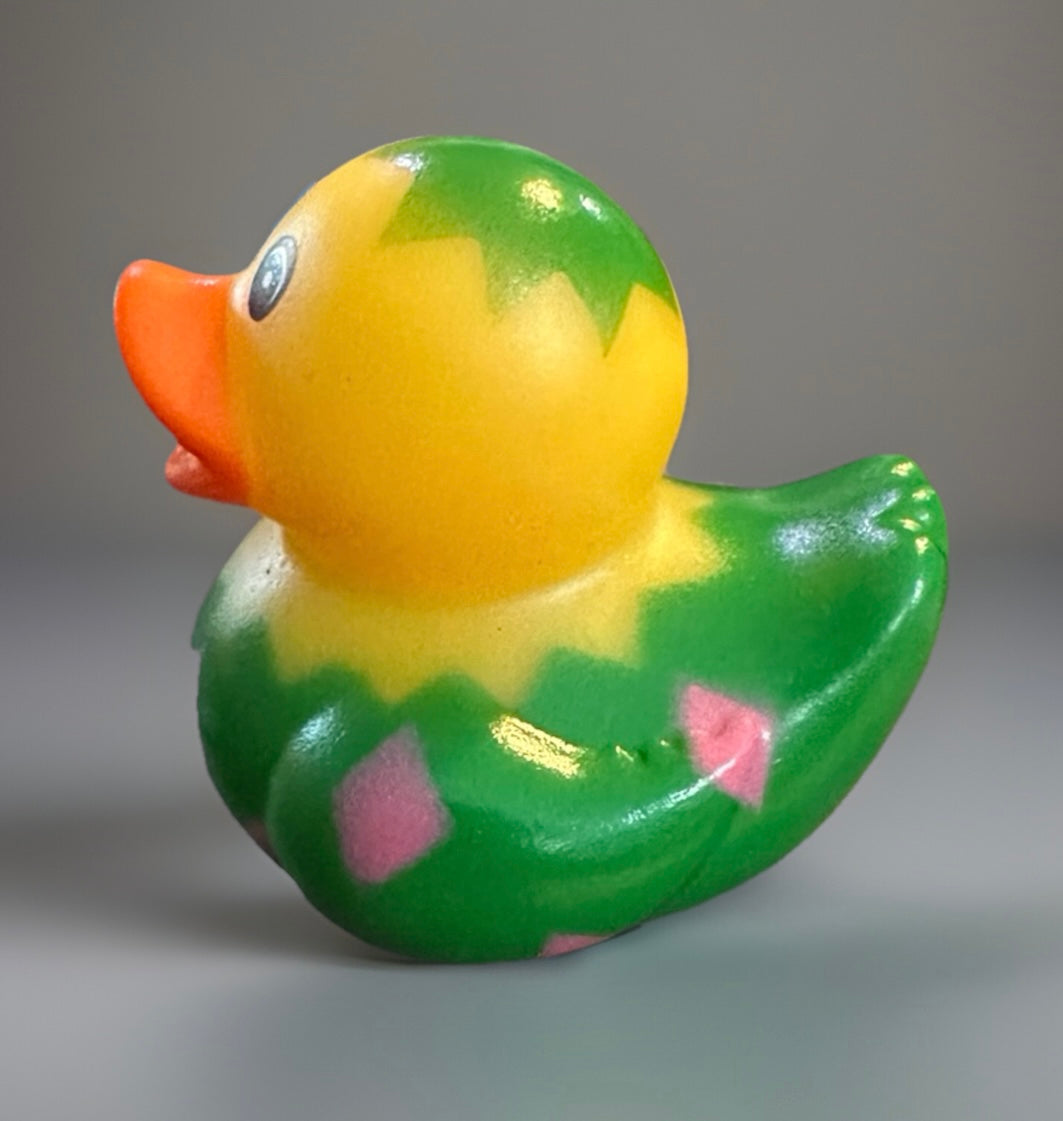 Colorful Easter egg rubber duck with green, yellow, and orange design from Reed’s Rubber Ducks and Sensory Shop
