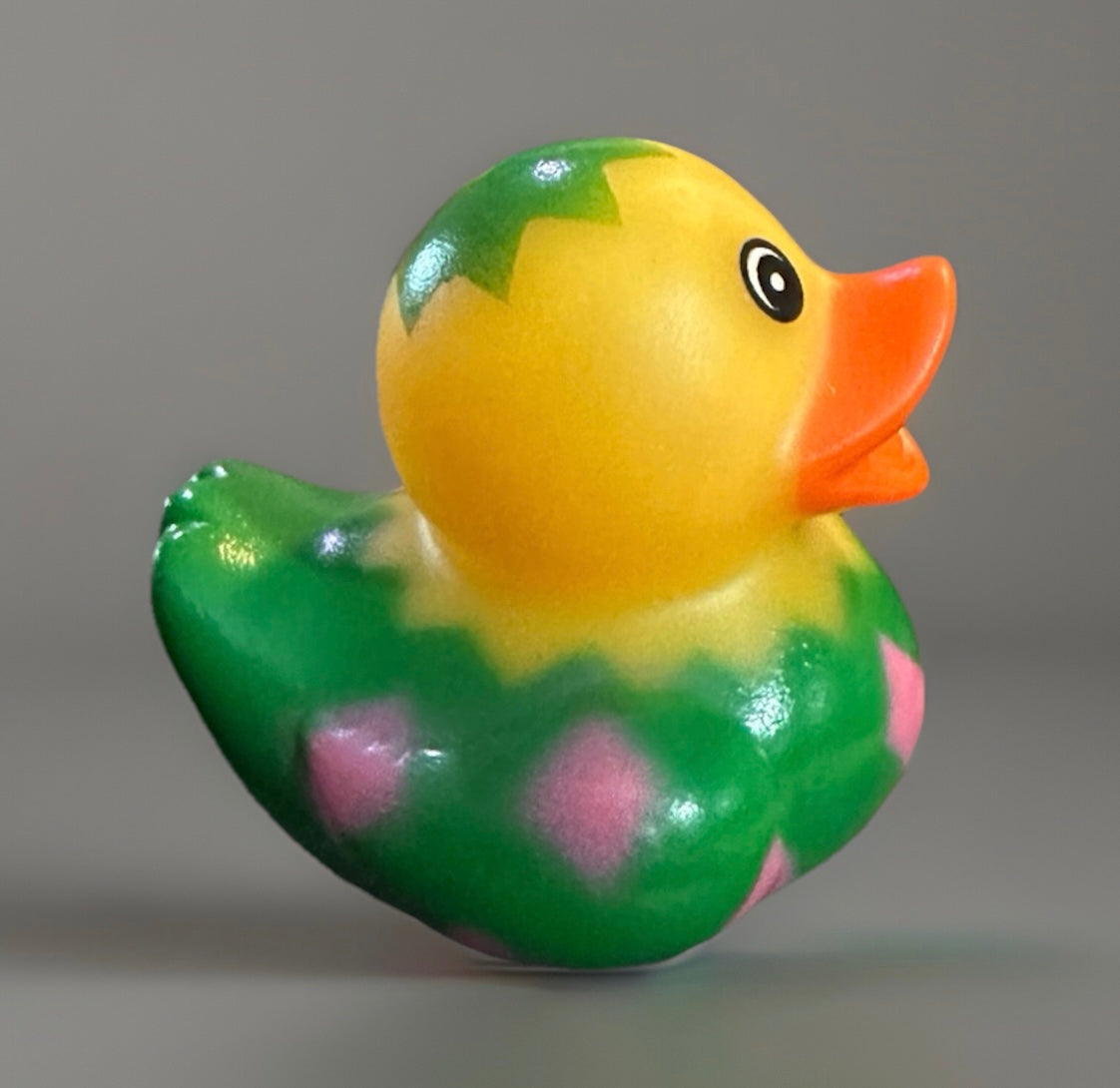 Yellow and green Easter egg rubber duck with pink diamond patterns and orange beak