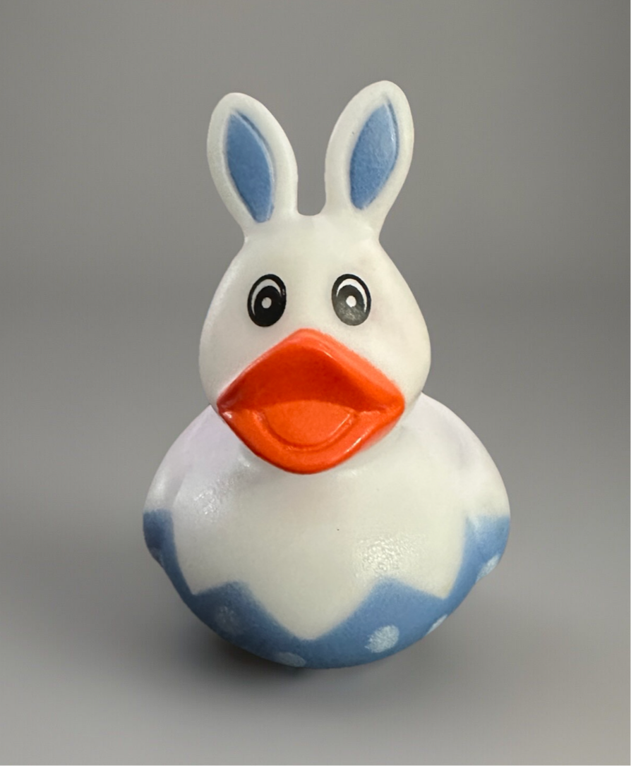 Easter gift rubber duck with bunny ears and blue accents for festive celebrations
