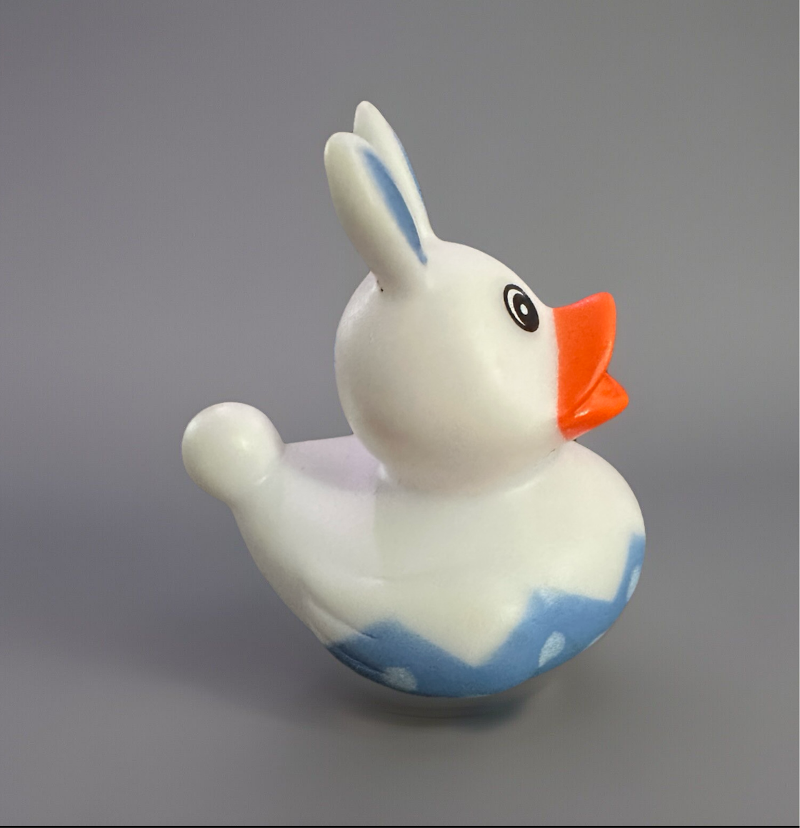 Cute Easter gift rubber duck designed with bunny ears and pastel colors for festive celebrations