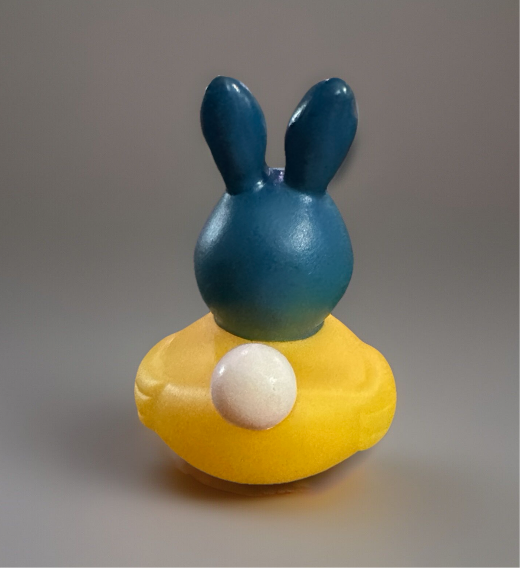 Cute Easter rubber duck collectibles featuring a blue bunny design on a yellow base