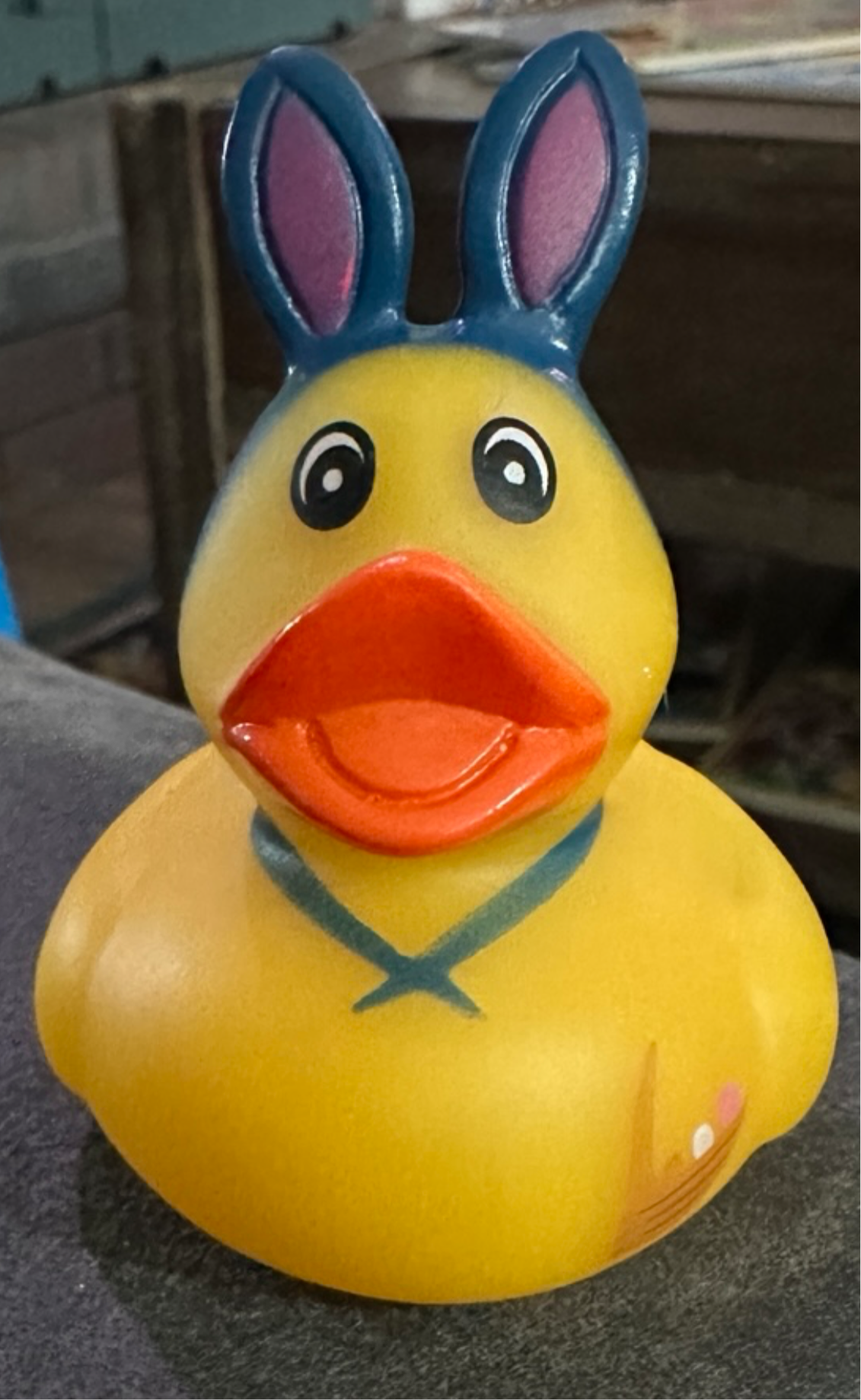 Cute Easter rubber duck collectibles featuring bunny ears and a cheerful expression