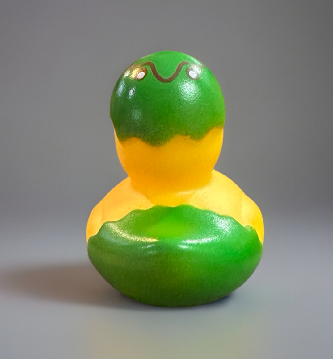 Green Easter egg rubber duck with a fun design, perfect for spring celebrations and bath time fun