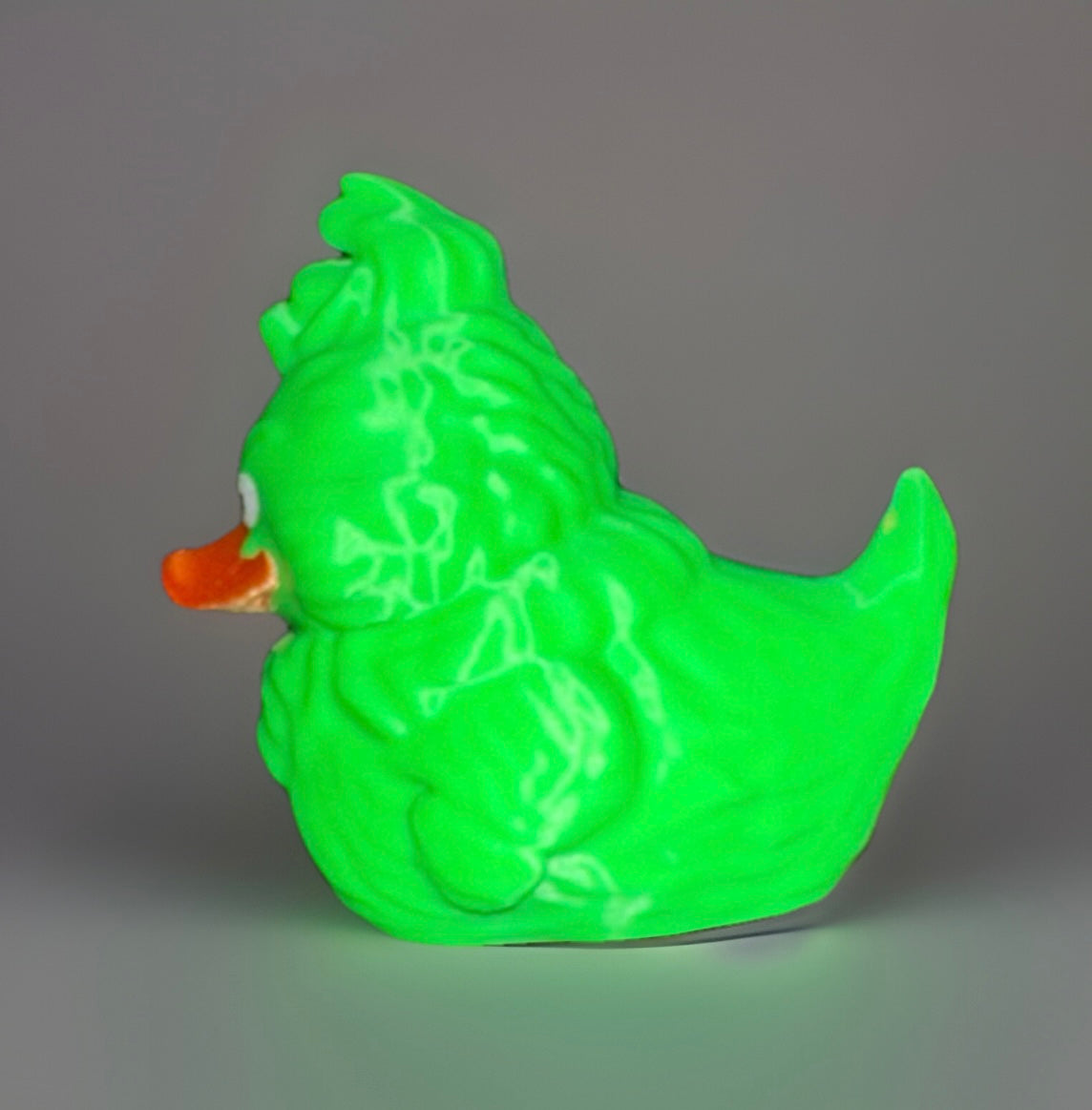 Green Grinch theme duck with orange beak and detailed textured body by Reeds Rubber Ducks