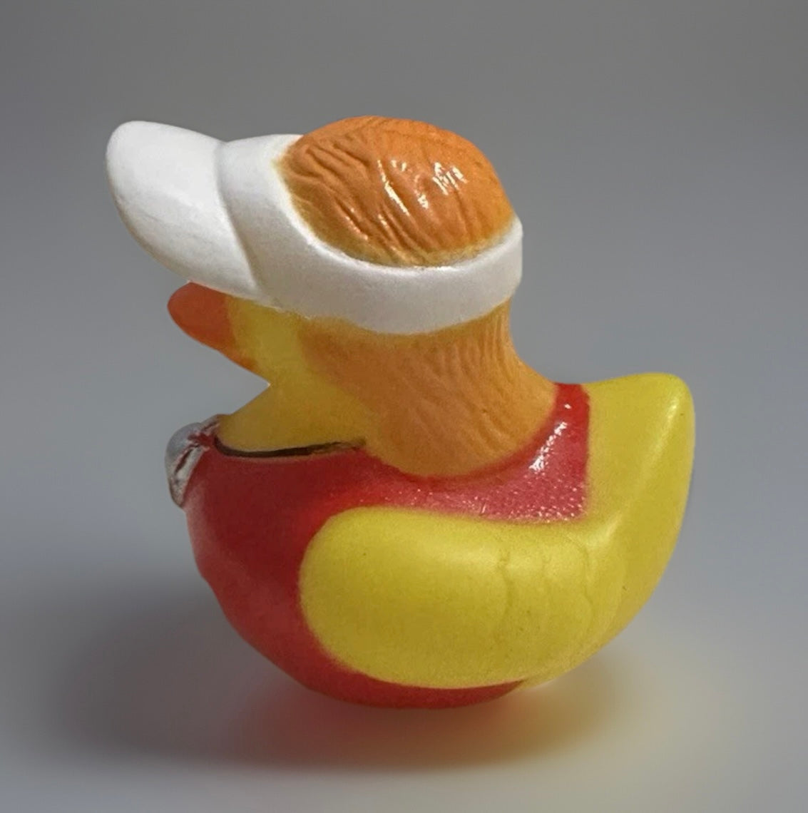 Reed’s Rubber Ducks lifeguard rubber duck wearing red swimsuit and white visor hat