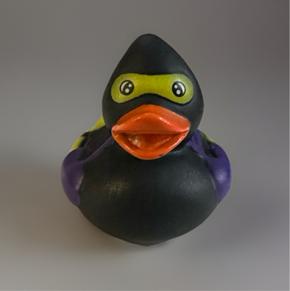 Reed’s Rubber Ducks and Sensory Shop ninja rubber duck 2 inch in black with purple details and orange beak
