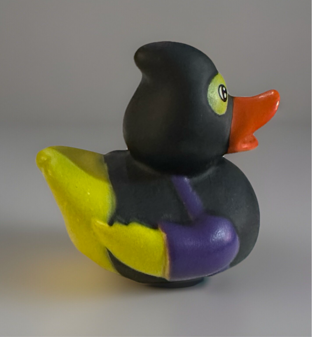 Ninja rubber duck 2 inch with black, yellow, and purple colors and orange beak by Reed’s Rubber Ducks and Sensory Shop