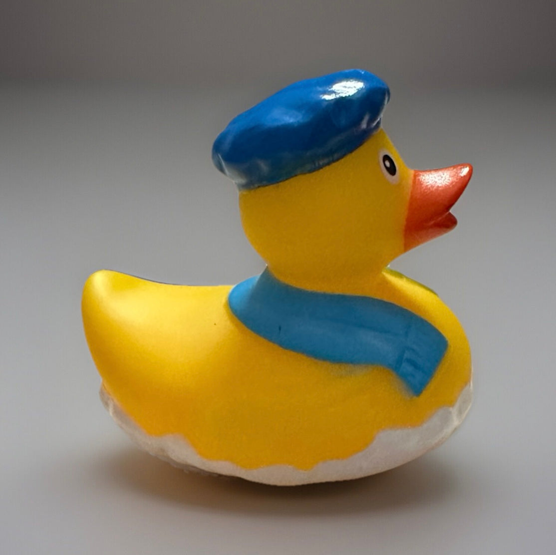 Yellow novelty rubber duck wearing a blue sailor hat and scarf from Reed’s Rubber Ducks and Sensory Shop