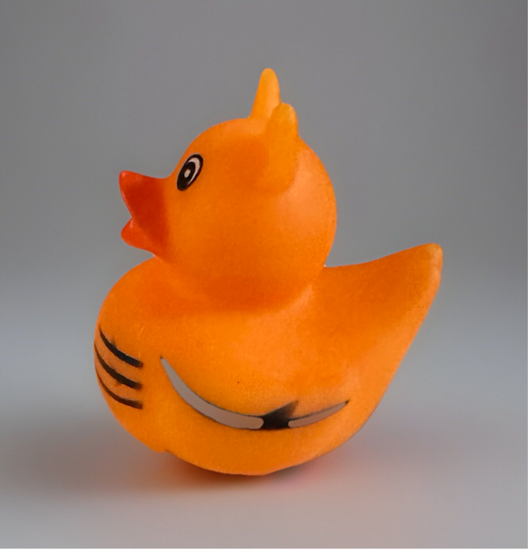 Orange tiger rubber duck with black stripes and detailed eyes from Reed’s Rubber Ducks and Sensory Shop