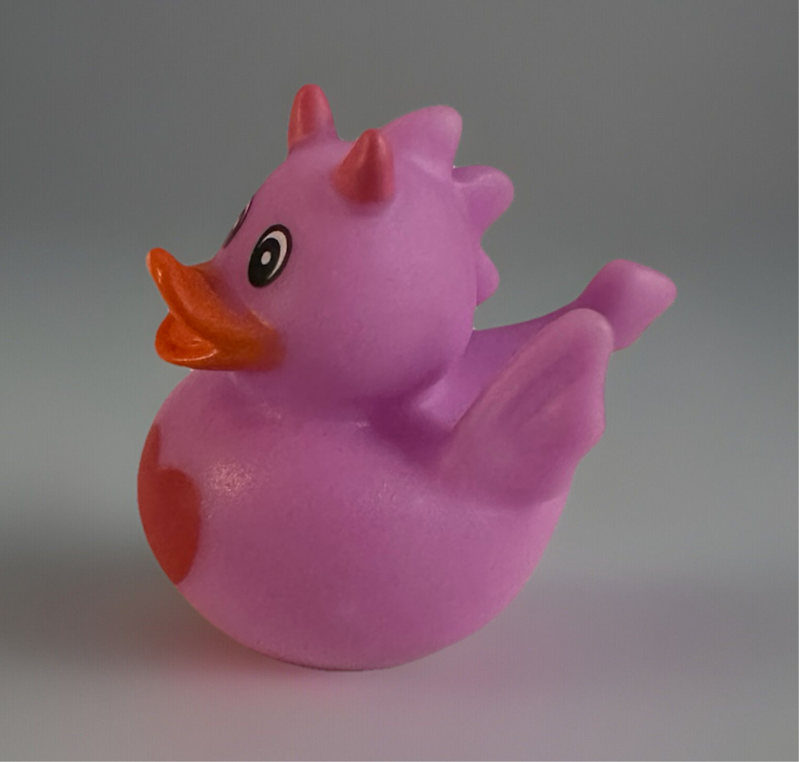 Pink heart dragon rubber duck with orange beak and small horns by Reeds Rubber Ducks