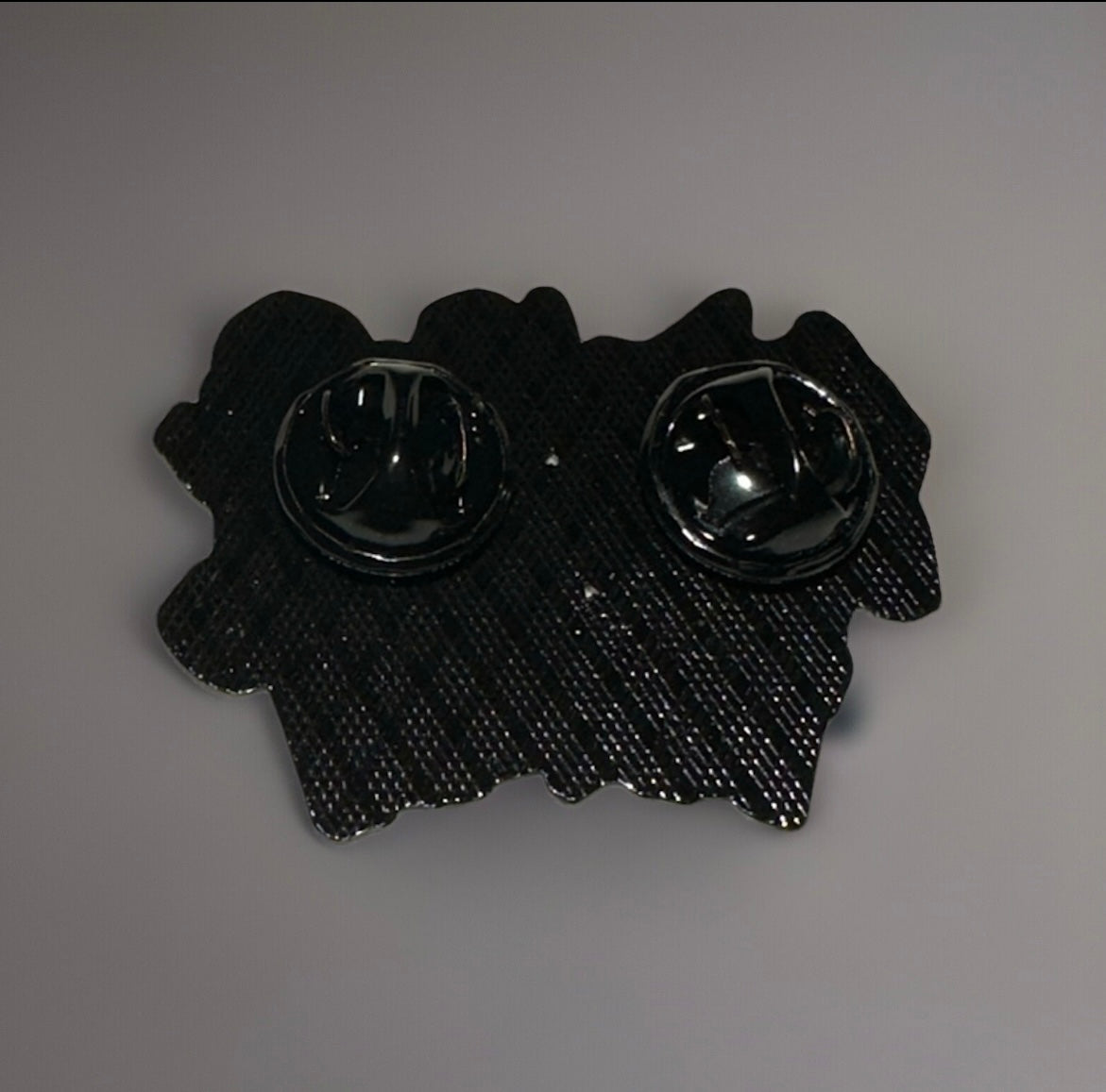 Back view of Pikachu Bulbasaur Charmander Squirtle pin with black metal clasps from Reed’s Rubber Ducks and Sensory Shop