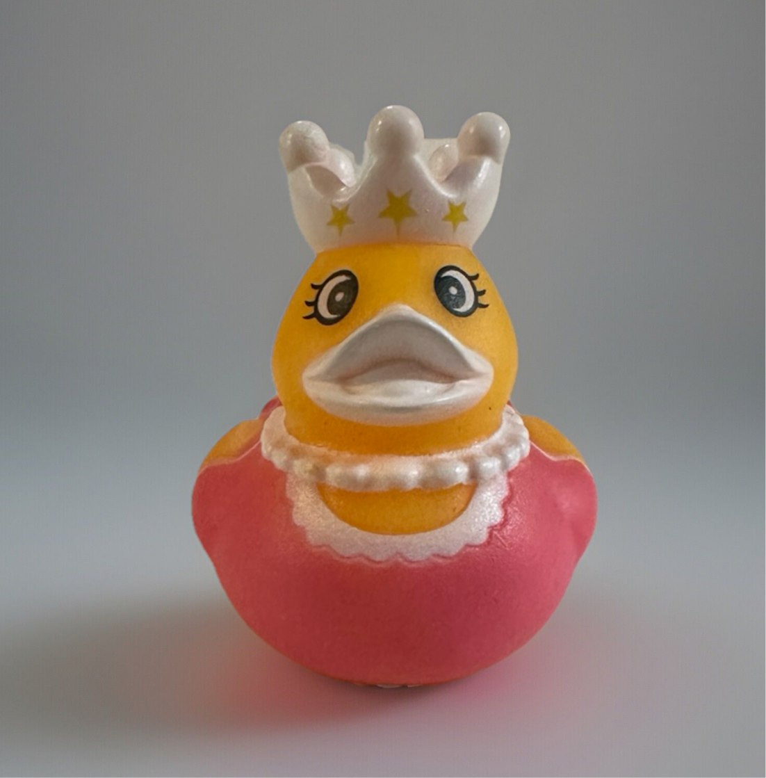 2 inch princess duck toy from Reed’s Rubber Ducks and Sensory Shop wearing a pink dress and white crown