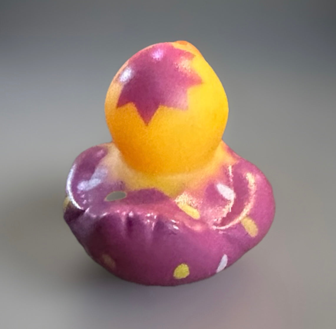 Purple Easter egg rubber duck with yellow and purple cracked egg design from Reed’s Rubber Ducks and Sensory Shop