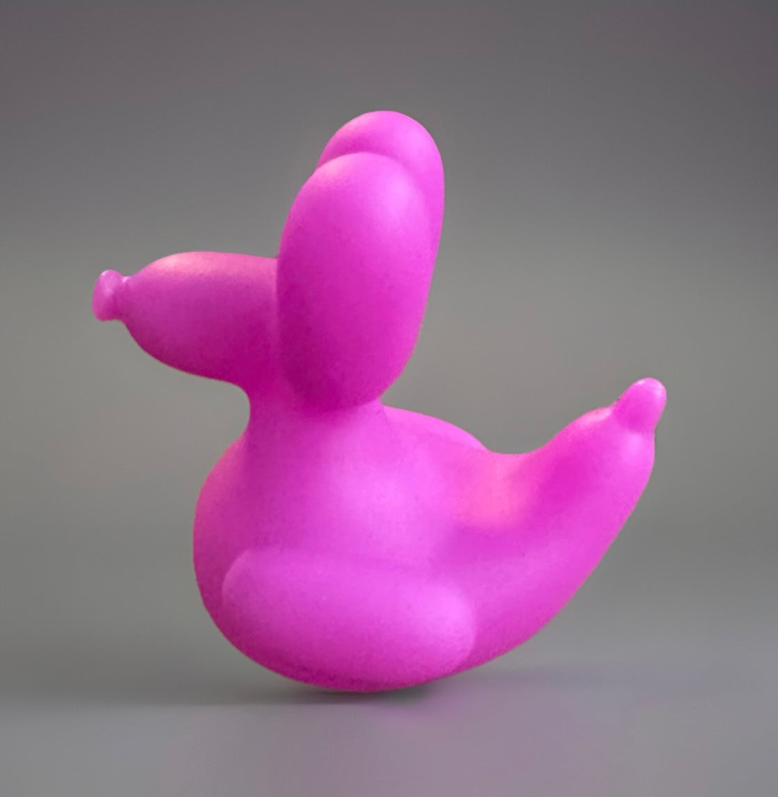 Bright purple rubber duck gift shaped like a balloon animal for fun sensory play