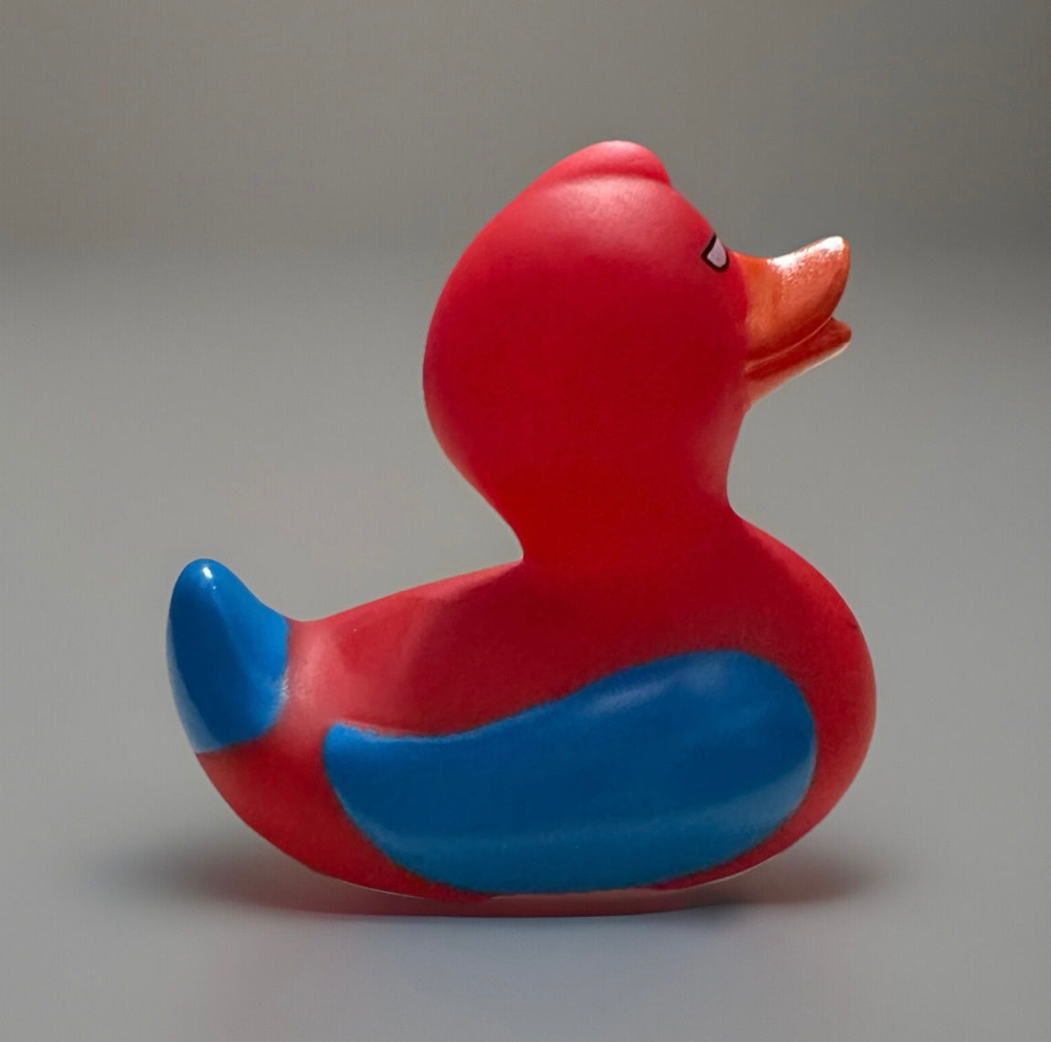 Spider Man rubber duck in red and blue colors with orange beak from Reed’s Rubber Ducks and Sensory Shop