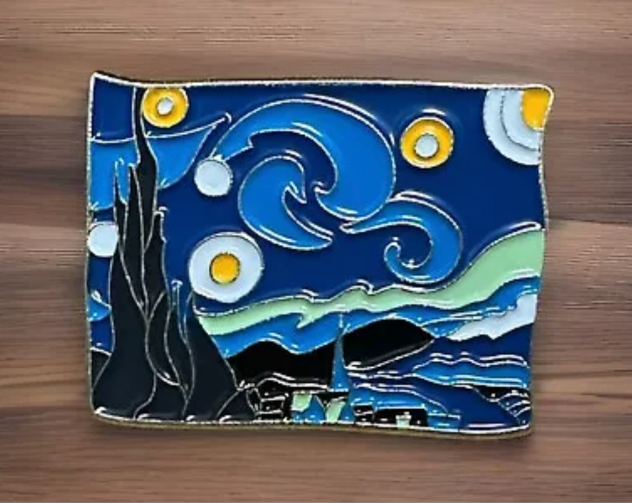 Starry Night lapel pin featuring swirling blue sky and yellow stars inspired by van Gogh's artwork