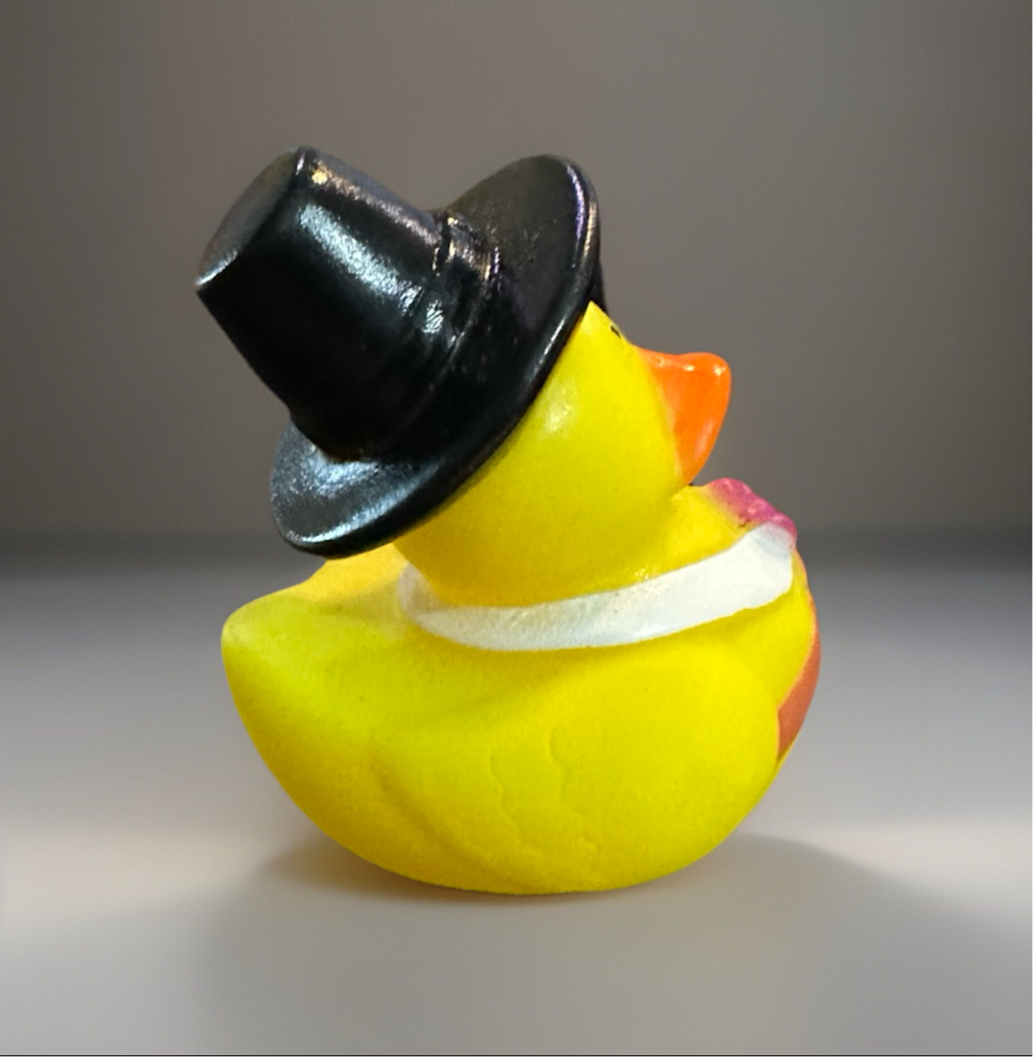 Thanksgiving rubber duck collectible featuring a yellow duck with a black pilgrim hat and white collar