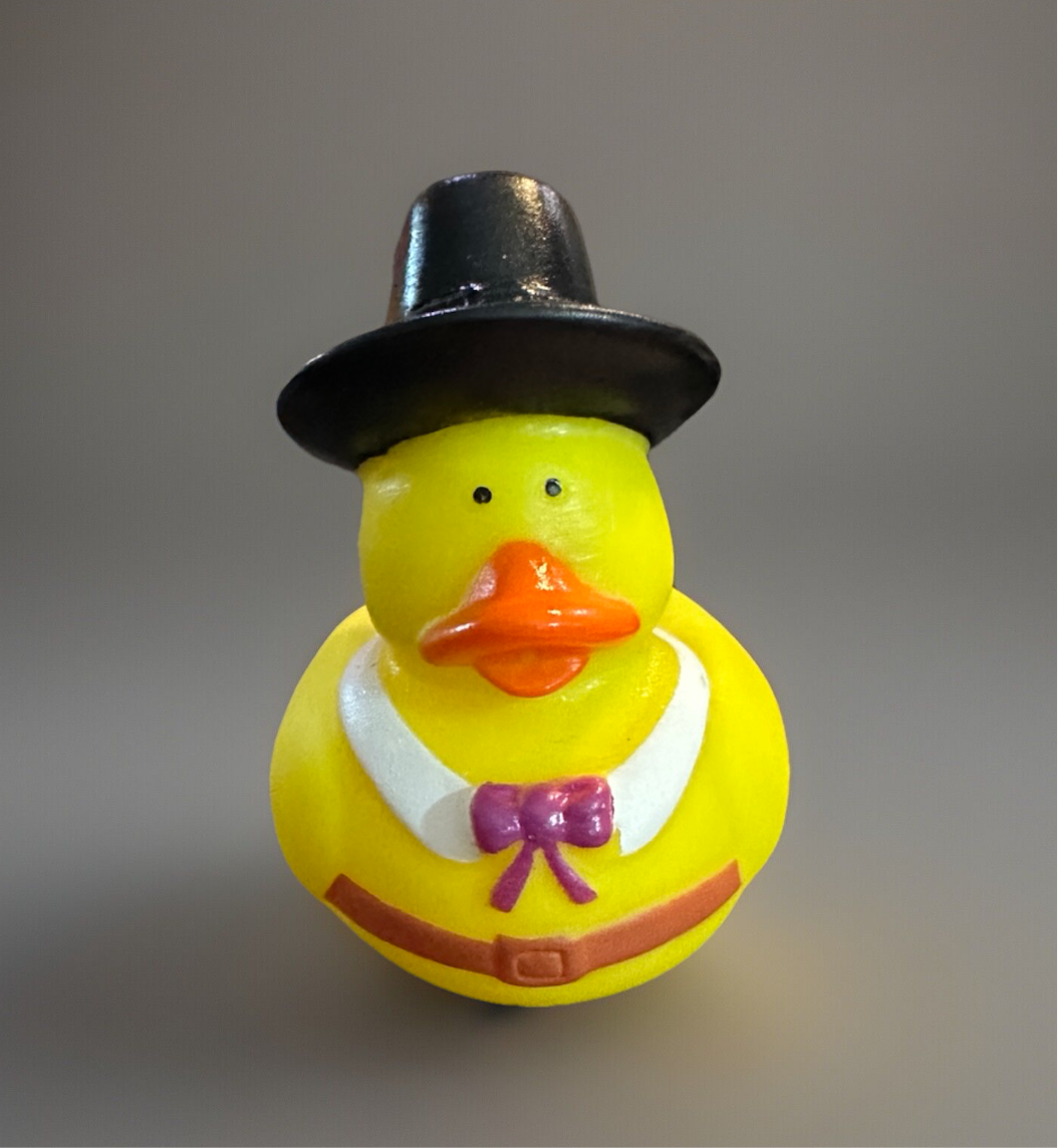 Thanksgiving rubber duck collectible dressed as a Pilgrim with a black hat and bowtie