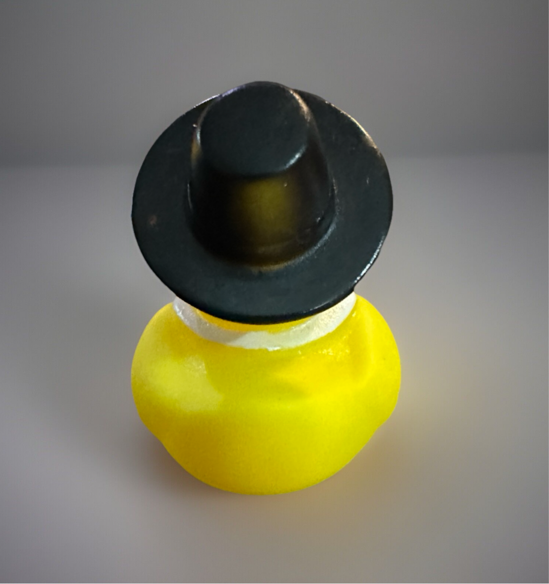 Thanksgiving rubber duck collectible dressed as a Pilgrim with a black hat for holiday celebrations