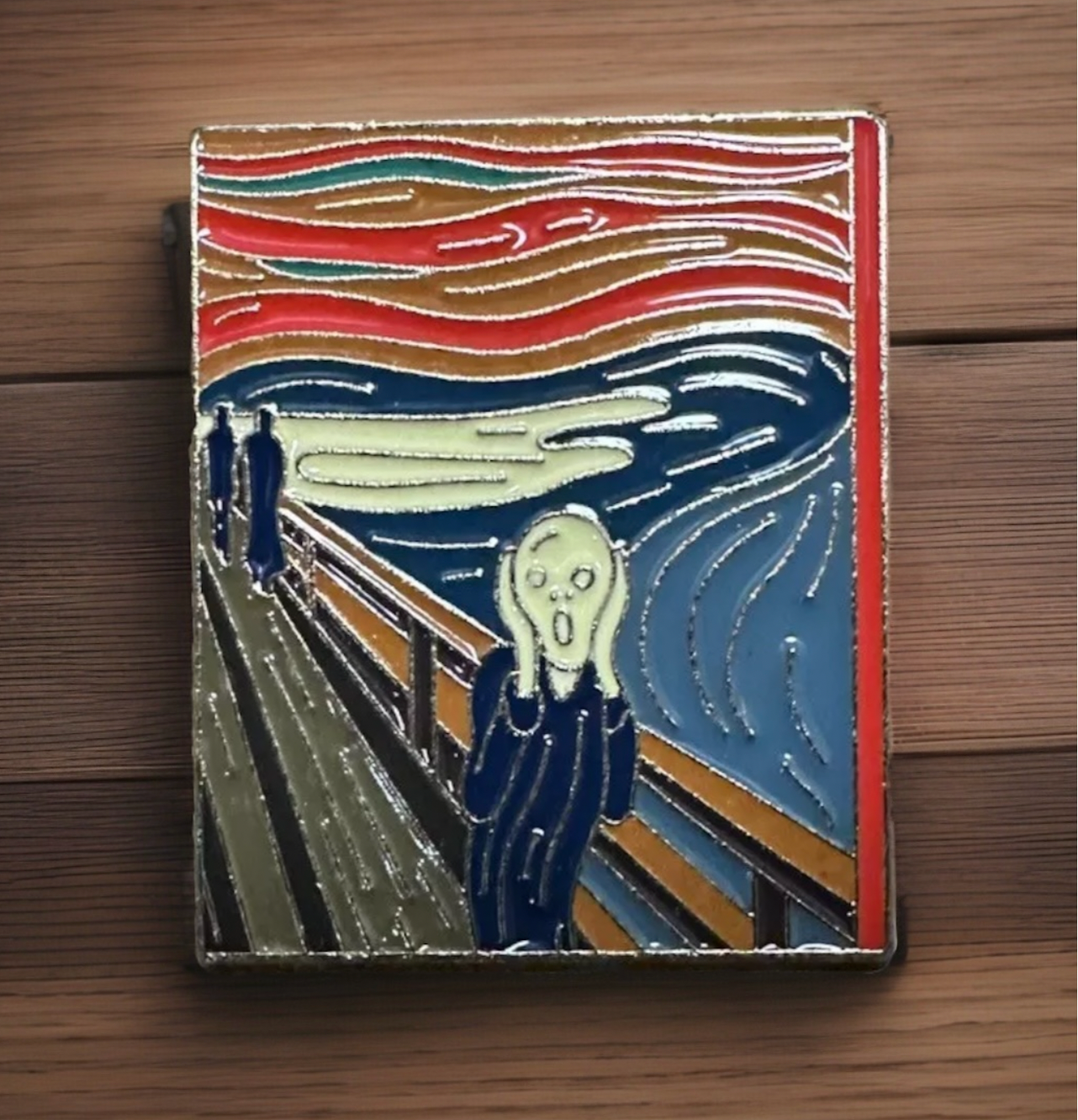 The Scream enamel pin by Reed’s Rubber Ducks and Sensory Shop featuring colorful design inspired by Edvard Munch painting