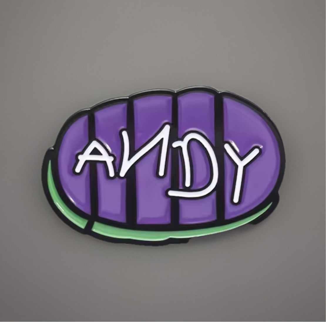 Toy Story Andy pin featuring purple sole design with white Andy text outlined in black