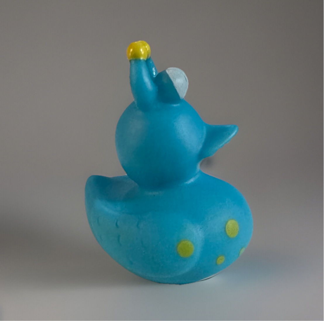 Turquoise snail rubber duck with yellow and light blue details from Reed’s Rubber Ducks and Sensory Shop
