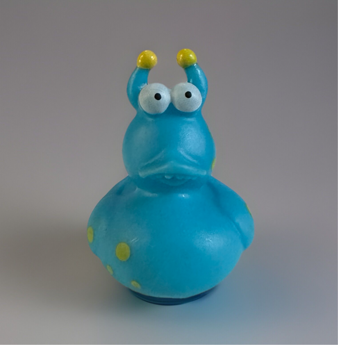 Turquoise snail rubber duck with yellow antennae and spots from Reed’s Rubber Ducks and Sensory Shop