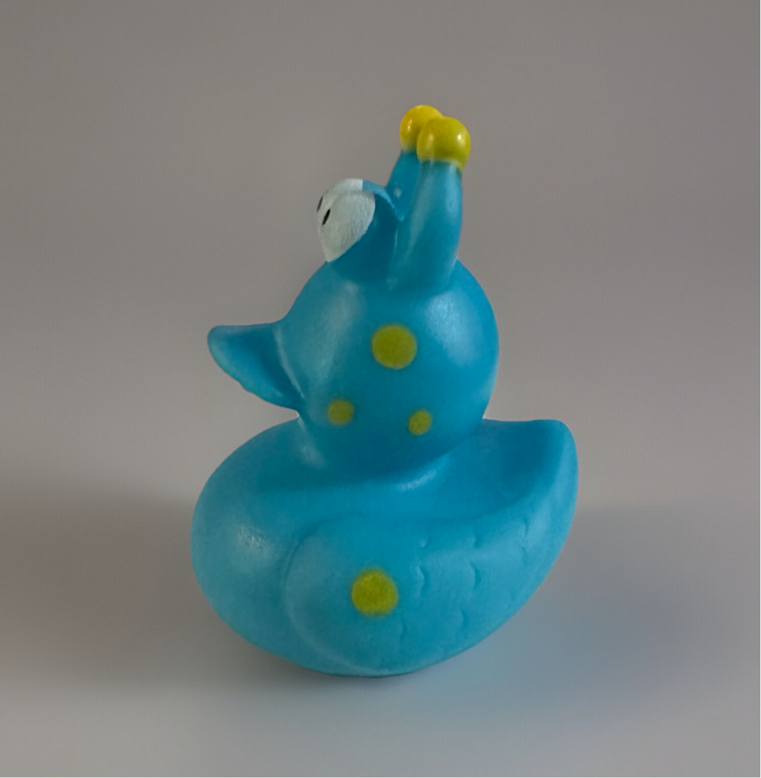 Turquoise snail rubber duck with yellow spots and eyes from Reeds Rubber Ducks and Sensory Shop