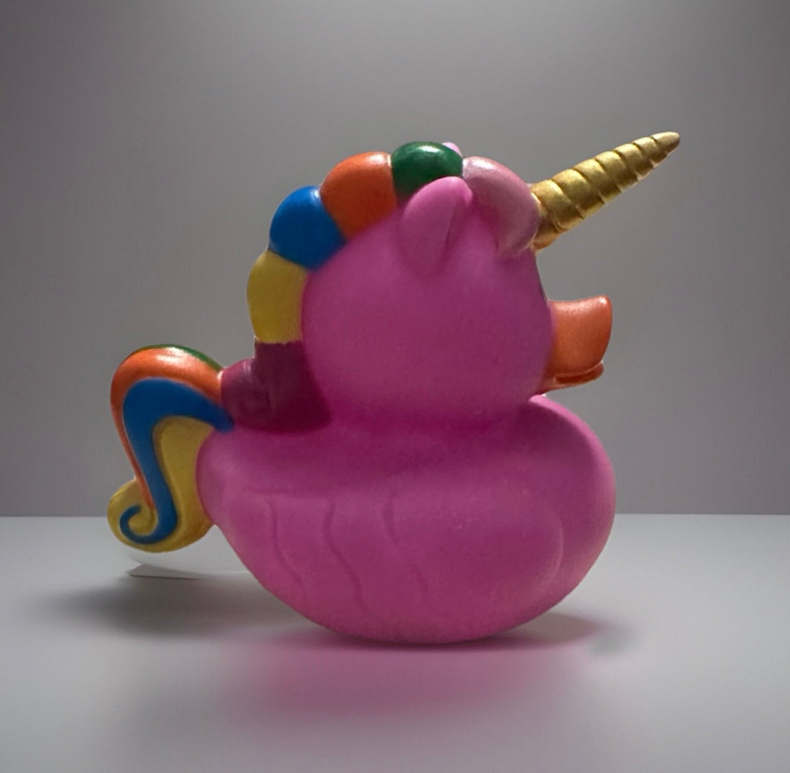 Pink unicorn rubber duck with a gold horn and colorful mane by Reeds Rubber Ducks and Sensory Shop