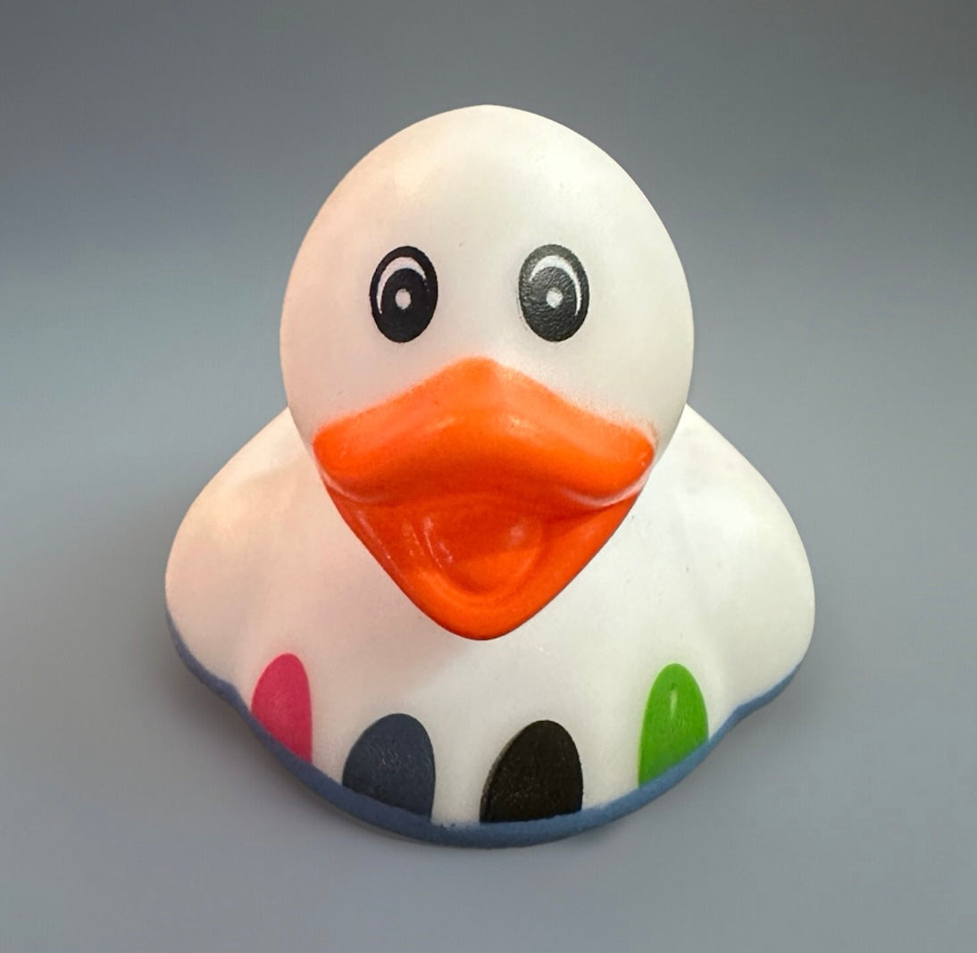 White Easter rubber duck with orange beak and colorful spots from Reed’s Rubber Ducks and Sensory Shop