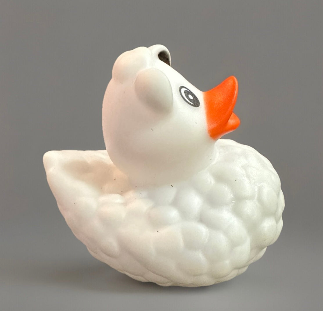White sheep rubber duck with textured body and bright orange beak from Reed’s Rubber Ducks and Sensory Shop