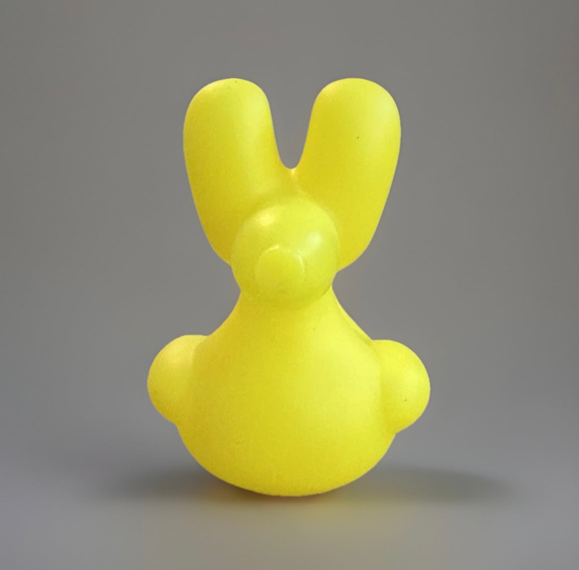 Yellow balloon animal rubber duck with bunny ears from Reed’s Rubber Ducks and Sensory Shop