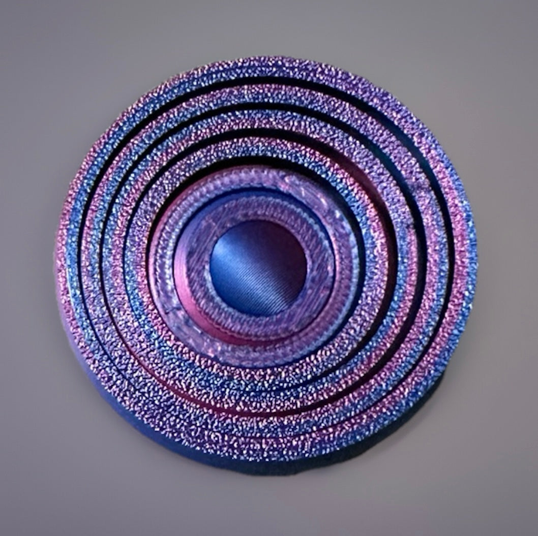 Purple and blue metallic 3D gyro finger fidget spinner with concentric circular design