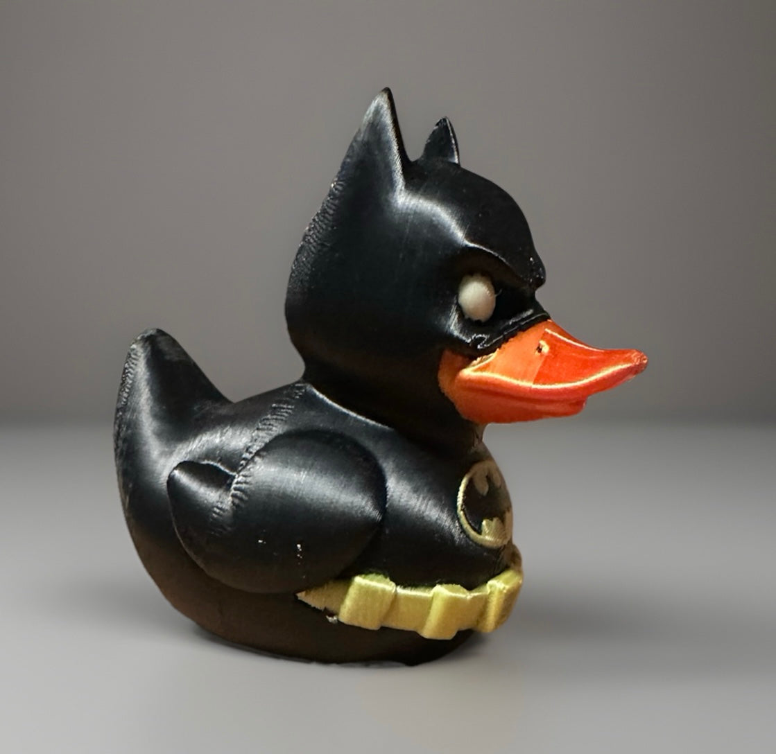 3D printed Batman duck in black with yellow belt and orange beak from Reed’s Rubber Ducks and Sensory Shop