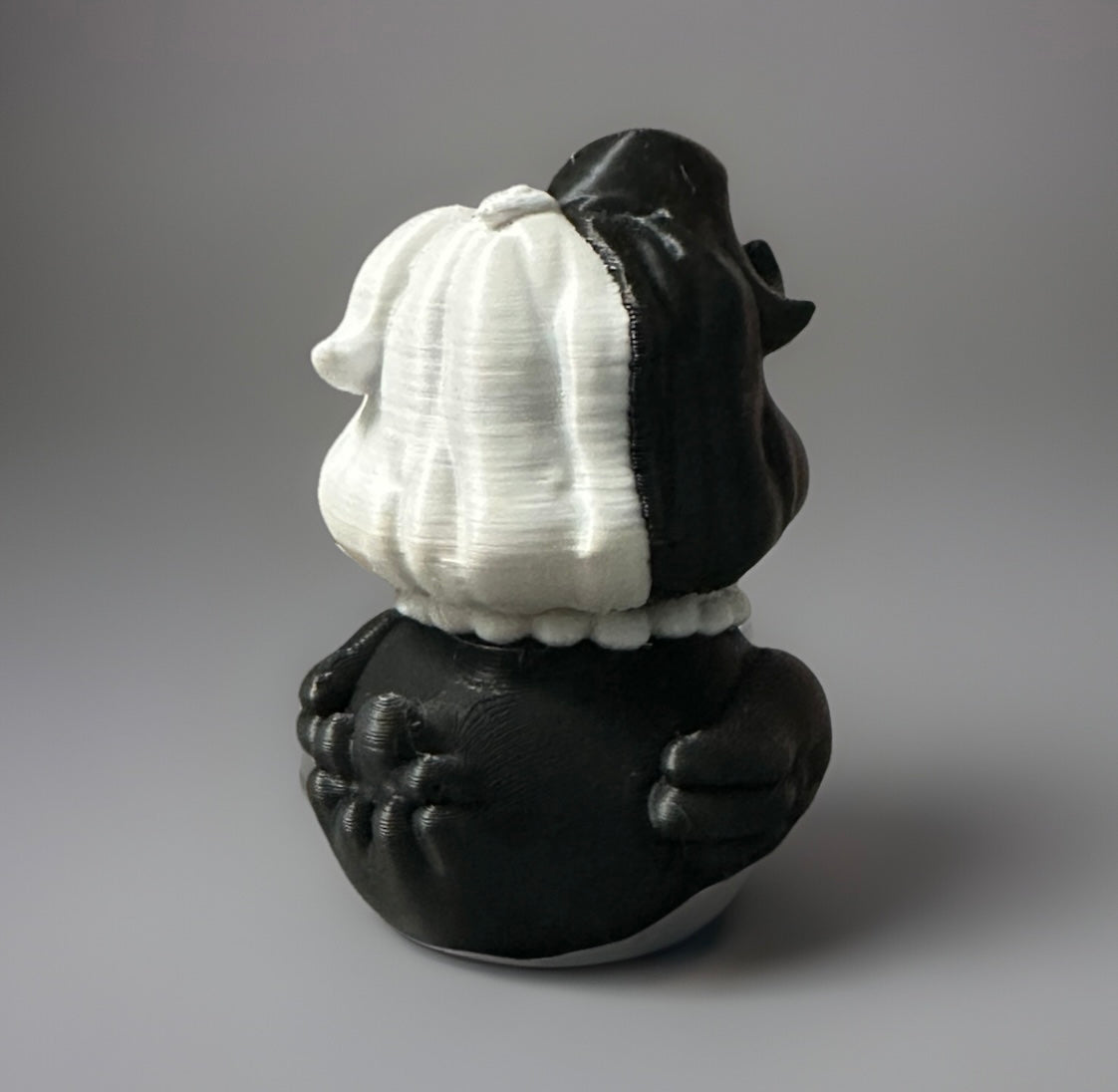 3D printed Cruella duck in black and white with detailed hair and claw design from Reed’s Rubber Ducks and Sensory Shop