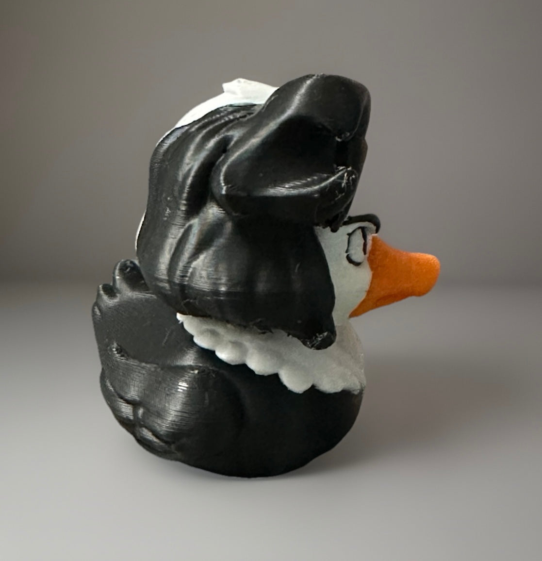 3D printed Cruella duck with black hair and white collar by Reeds Rubber Ducks and Sensory Shop