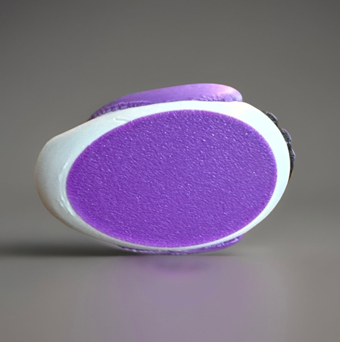 Bottom view of a purple and white 3D printed FedEx duck from Reed’s Rubber Ducks and Sensory Shop