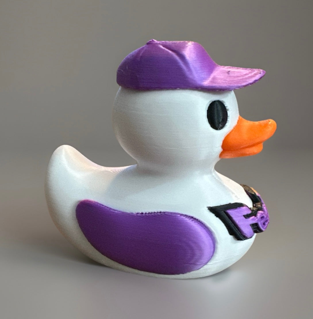 3D printed FedEx duck with white body purple wings and cap featuring an orange beak