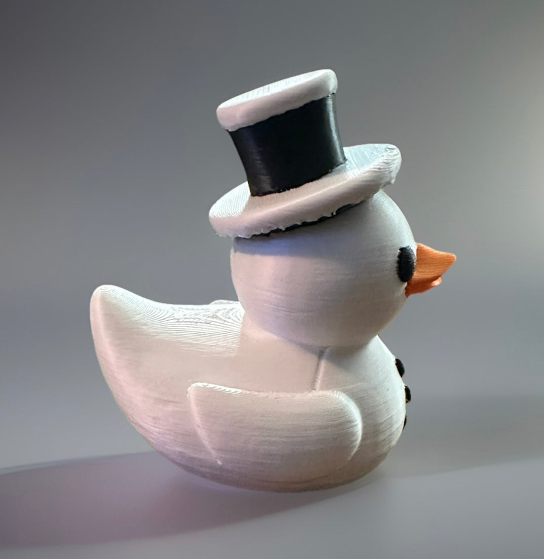 3D printed snowman duck wearing a black top hat from Reed’s Rubber Ducks and Sensory Shop