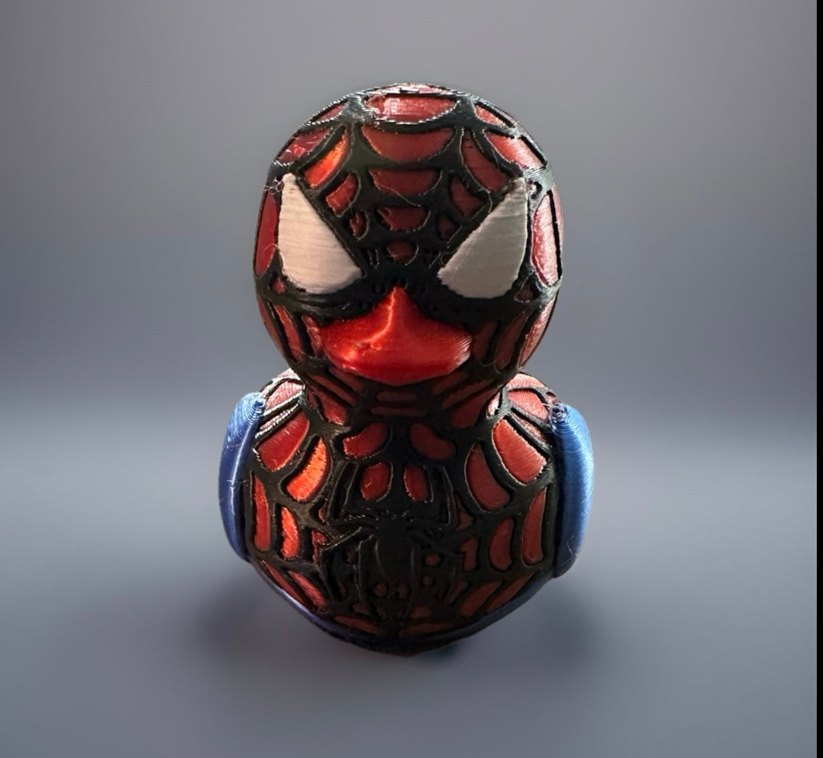 3D printed Spider-Man duck with detailed web pattern and white eyes from Reed’s Rubber Ducks and Sensory Shop