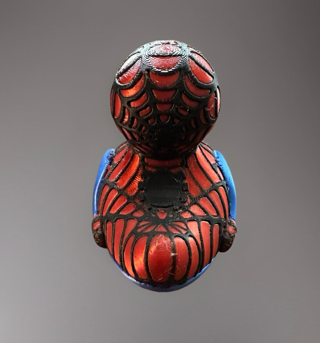 Top view of 3D printed Spider-Man duck with detailed black web design and red blue color
