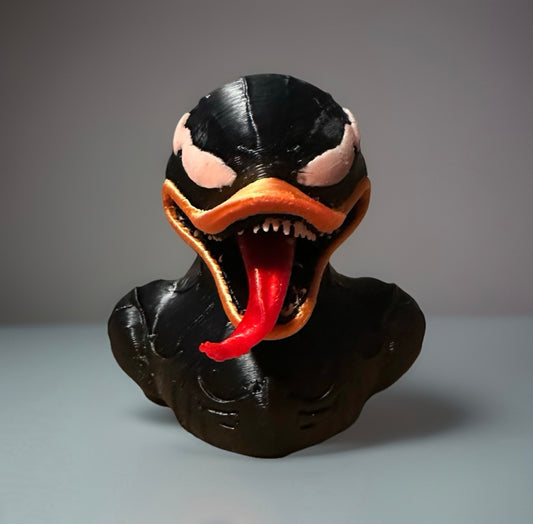 3D printed Venom duck with black body, sharp teeth, and long red tongue from Reed’s Rubber Ducks and Sensory Shop